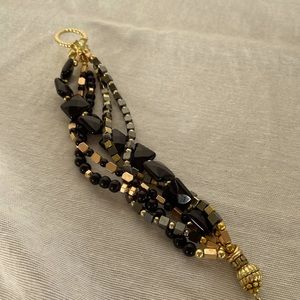 Beautiful 5 strand Black Onyx Bracelet, accented with gold